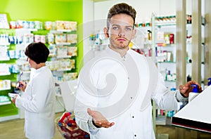 Glad man druggist in white coat