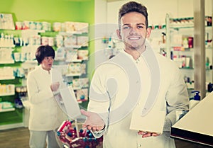 Glad man druggist in white coat