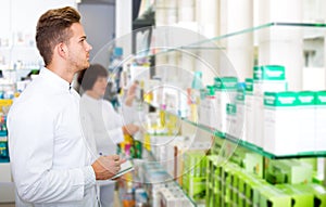 Glad man druggist in white coat