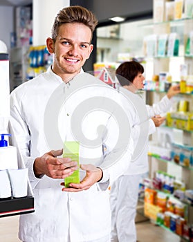 Glad man druggist in white coat photo