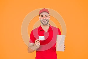 Glad to serve. Unique offer. Man red cap yellow background. Delivering purchase. Delivered to your destination. Service