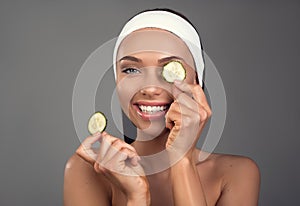 Glad woman nourishing skin with natural vitamins