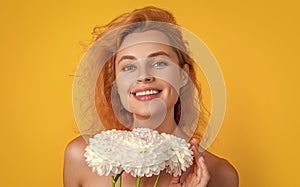 glad woman with womens day flowers in studio. woman with womens day flowers photo