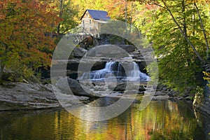 Glade Creek Grist Mil and autumn reflections and water fall in Babcock State Park, WV