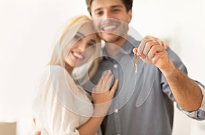 Gladful Couple Holding New Aparment Key, Shallow Depth