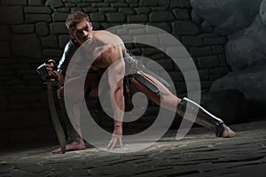 Gladiator with sword kneeling