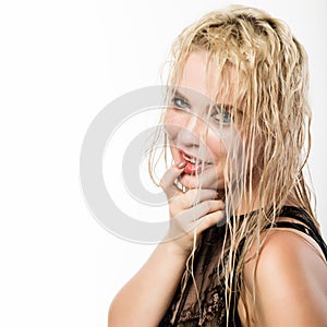 Glamor beautiful blonde girl with wet hair and skin. Bright makeup and plump lips with a damp effect. free space for