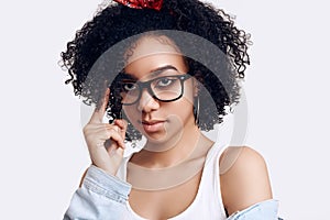 Glamor elegant black hippie teenage girl model with curly hair