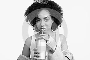 Glamor elegant black hippie teenage girl model with curly hair with soda