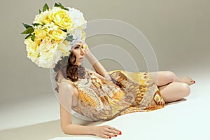 Glamor portrait of woman with floral hat