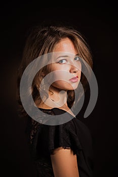 Glamor woman dark face portrait, beautiful female isolated on black background, stylish look, young lady studio shot