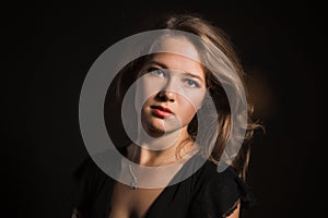 Glamor woman dark face portrait, beautiful female isolated on black background, stylish look, young lady studio shot