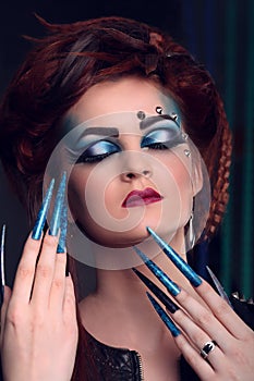 Glamor woman with long nail and bright makeup