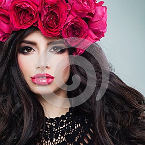 Glamorous Brunette Woman with Curly Hair and Roses Wreath