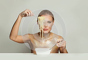 Glamorous celebrity woman eating instant noodles on white background