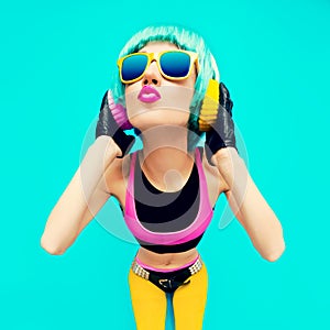 Glamorous Fashion DJ Girl in bright clothes on a blue background