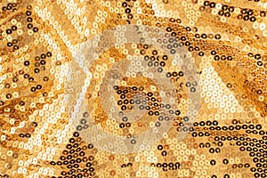 Glamorous golden metallic sparkling sequins background. Elegant party concept. Christmas or New year inspiration