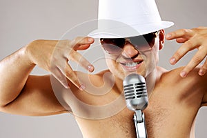 Glamorous man sing a song