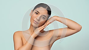 Glamorous natural beauty headshot portrait of a beautiful multiracial Turkish woman with perfect moisturized healthy