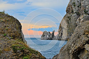 Glamorous sunset in the big rocks on the rocky shore of the Black sea, Crimea, Novy Svet