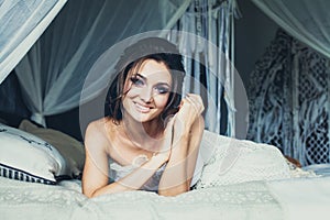 Glamorous Woman Fashion Model Lying on Bed