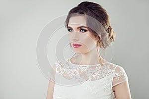 Glamorous woman with perfect makeup and bridal hair on white background, female face closeup