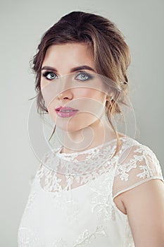 Glamorous woman portrait. Beautiful bride with makeup and bridal hairstyle, female face closeup