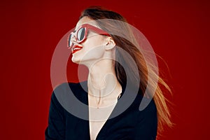 glamorous woman wearing sunglasses red lips posing close-up