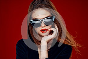 glamorous woman wearing sunglasses red lips posing close-up