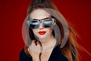 glamorous woman wearing sunglasses red lips posing close-up