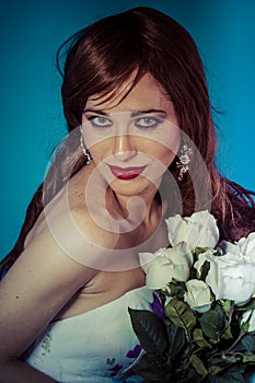 Glamour, attractive woman with bouquet of white roses