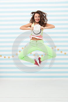 Glamour fashion model. Crazy girl in colorful sporty clothes. Happy and stylish woman. Hip hop woman dancer