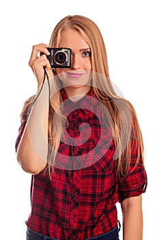 Glamour female photographer holding a compact camera - isolated