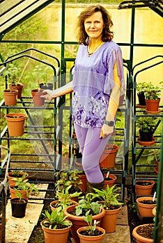 Glamour gardener in plant pot paradise.