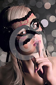 The glamour girl in a mask