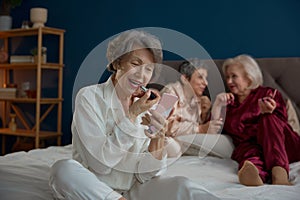 Glamour grandmothers pajamas party at cozy home on weekends photo