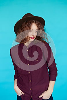 Glamour portrait of a beautiful brunette in stylish hat
