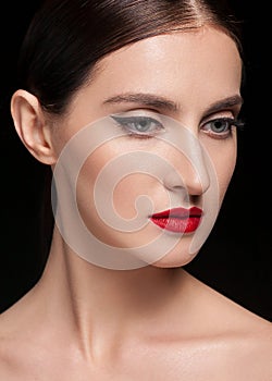 Glamour portrait of beautiful woman model with fresh daily makeup and hairstyle. Fashion shiny highlighter on skin,