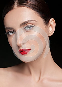 Glamour portrait of beautiful woman model with fresh daily makeup and hairstyle. Fashion shiny highlighter on skin,