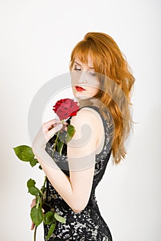 Glamour portrait of woman with red rose