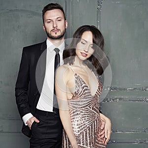 Glamour portrait of sexy young lovers. Fashionable elegant man and woman