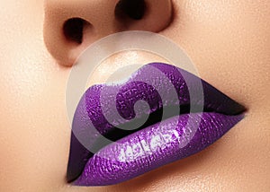 Glamour purple Gloss Lips with sensuality gesture. style, closeup macro shot female Lip Make-up. Sensuality mouth