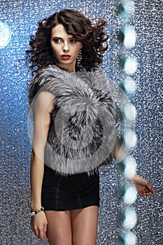Glamour. Shapely Good Looking Woman in Gray Fur Waistcoat photo