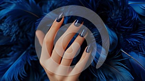 Glamour woman hand with luxury navy color nail polish manicure on fingers