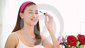 Glamour woman Makeup brush on with beauty brunette focus on happy face of young charming woman. Brush on cheek and smiling with ha