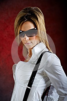 Glamourous young woman wearing sunglasses