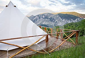Glamping tent detail with mountain range panorama