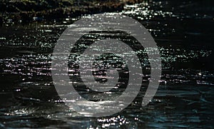 Glare on the water - dark photo
