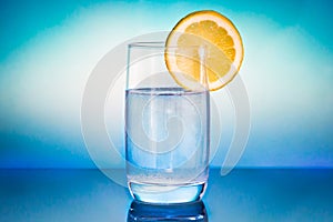 Glas of water with lemon photo