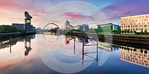 Glasgow panorama at dramatic sunrise with Clyde river, Scotland